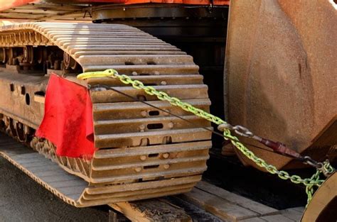 how to chain down a skid steer|how to use chain binders.